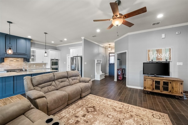 15070 Fm 916, Maypearl, TX 76064 - living area featuring ceiling fan, crown molding, recessed lighting, dark wood finished floors, and baseboards