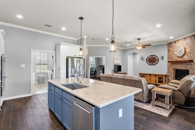 15070 Fm 916, Maypearl, TX 76064 - kitchen with a sink, blue cabinets, stainless steel appliances, open floor plan, and recessed lighting