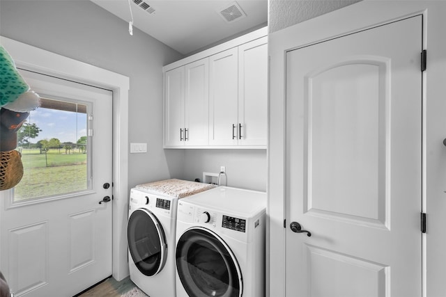 15070 Fm 916, Maypearl, TX 76064 - washroom with washer and dryer, cabinet space, and light wood-style floors