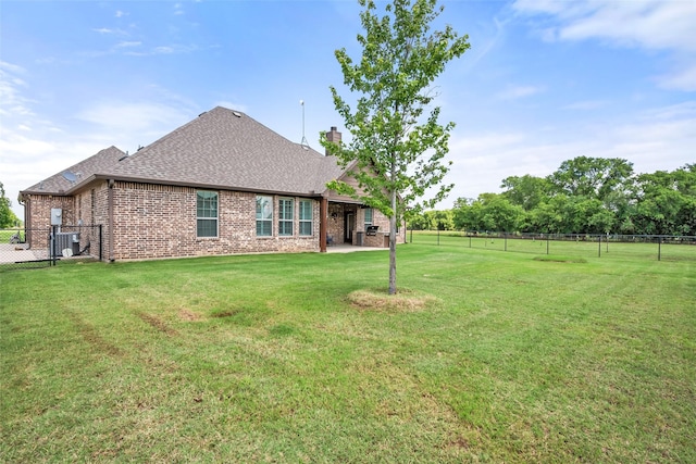 15070 Fm 916, Maypearl, TX 76064 - back of property featuring brick siding, a chimney, roof with shingles, a patio area, and central AC unit
