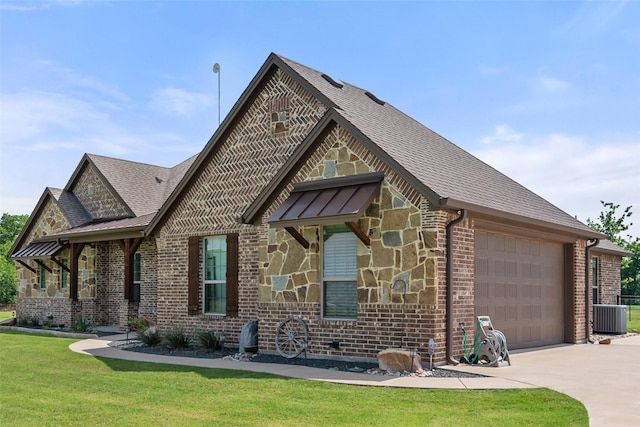 15070 Fm 916, Maypearl, TX 76064 - view of front facade featuring a garage, concrete driveway, brick siding, a front yard, and stone siding