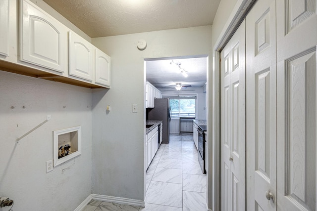 14520 Shoredale Ln, Farmers Branch, TX 75234 - washroom with light marble finish floors, washer hookup, a textured ceiling, baseboards, and a ceiling fan