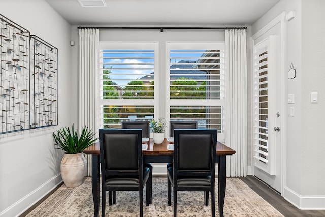 16471 Prairie Oak Rd, Frisco, TX 75033 - dining area featuring healthy amount of natural light, wood finished floors, and baseboards