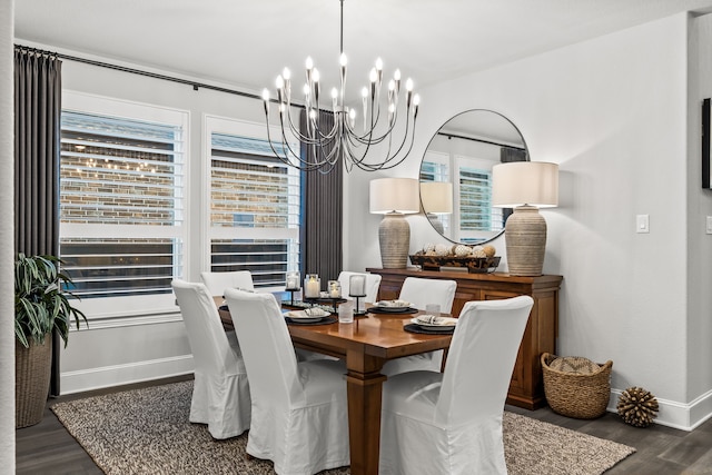 16471 Prairie Oak Rd, Frisco, TX 75033 - dining area with a chandelier, wood finished floors, and baseboards
