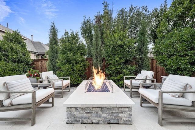 16471 Prairie Oak Rd, Frisco, TX 75033 - fenced backyard featuring a patio and an outdoor living space with a fire pit