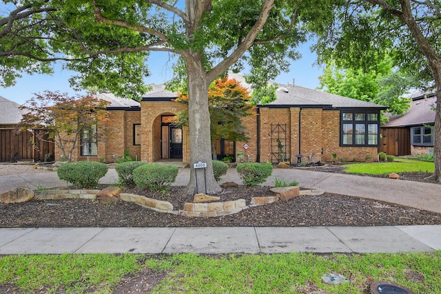 4000 Tumbril Ln, Plano, TX 75023 - view of front facade featuring brick siding and a shingled roof