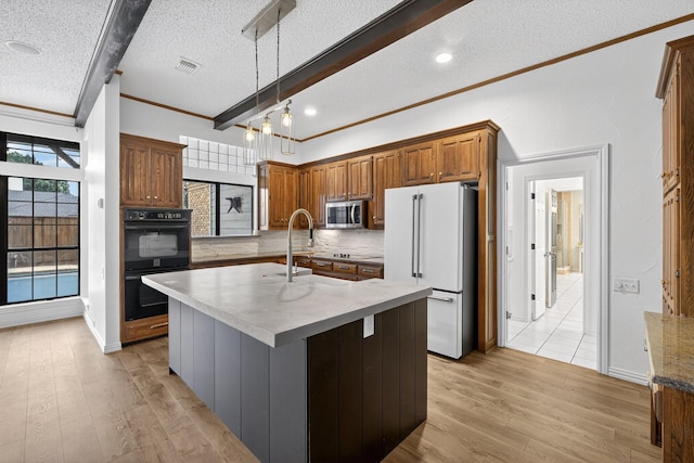4000 Tumbril Ln, Plano, TX 75023 - kitchen featuring black appliances, crown molding, a textured ceiling, backsplash, and light wood-style floors