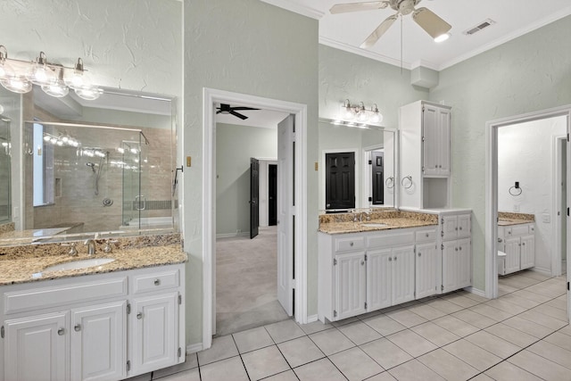 4000 Tumbril Ln, Plano, TX 75023 - full bath with a ceiling fan, tile patterned floors, two vanities, a shower stall, and crown molding