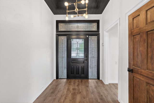 4000 Tumbril Ln, Plano, TX 75023 - foyer with a chandelier, baseboards, wood finished floors, and wooden ceiling
