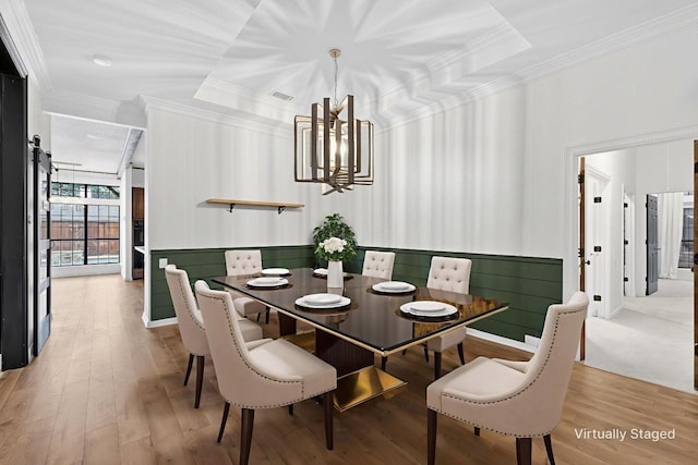 4000 Tumbril Ln, Plano, TX 75023 - dining space featuring crown molding, a chandelier, and light wood finished floors