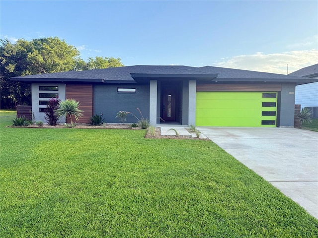 330 W Morris St, Rhome, TX 76078 - view of front of property with concrete driveway, an attached garage, a front lawn, roof with shingles, and brick siding
