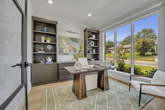 7141 Lyre Ln, Dallas, TX 75214 - home office with light wood finished floors, vaulted ceiling, and recessed lighting