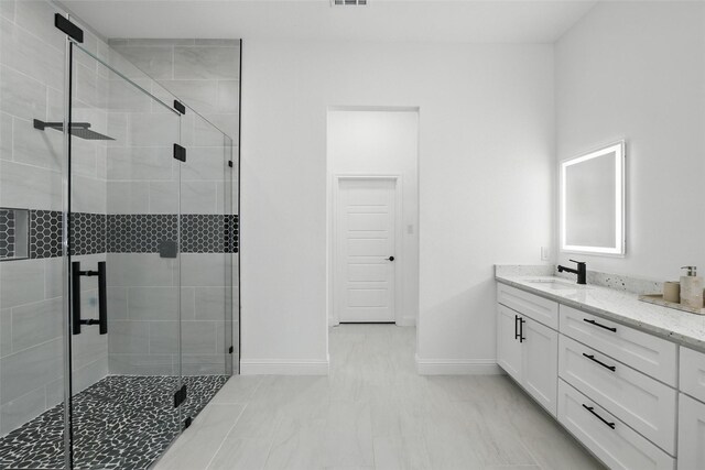 3220 N Houston, Fort Worth, TX 76106 - full bath featuring vanity, baseboards, a shower stall, and marble finish flooring