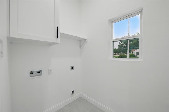 3220 N Houston, Fort Worth, TX 76106 - laundry room featuring cabinet space, hookup for an electric dryer, baseboards, and washer hookup
