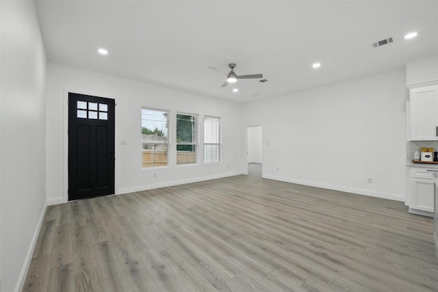 3220 N Houston, Fort Worth, TX 76106 - unfurnished living room with light wood-style flooring, ceiling fan, recessed lighting, and baseboards