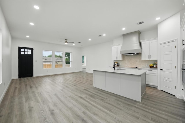 3220 N Houston, Fort Worth, TX 76106 - kitchen featuring premium range hood, ceiling fan, light countertops, light wood finished floors, and recessed lighting