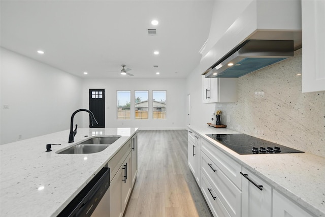 3220 N Houston, Fort Worth, TX 76106 - kitchen featuring wall chimney range hood, a sink, black electric stovetop, stainless steel dishwasher, and light wood-style flooring