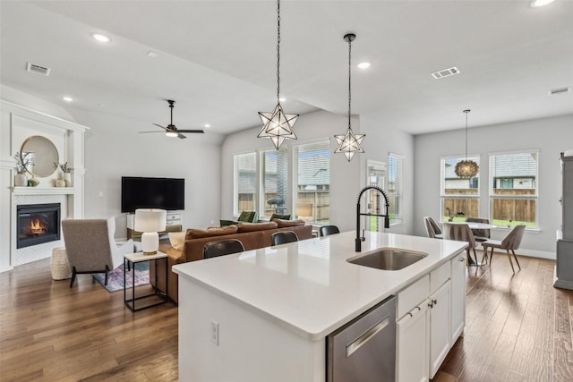 719 Forefront Ave, Celina, TX 75009 - kitchen featuring a sink, recessed lighting, a tile fireplace, pendant lighting, and dishwasher