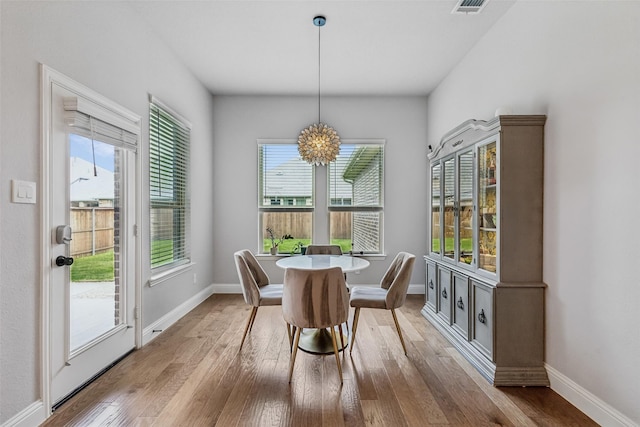 719 Forefront Ave, Celina, TX 75009 - dining room featuring wood finished floors and plenty of natural light