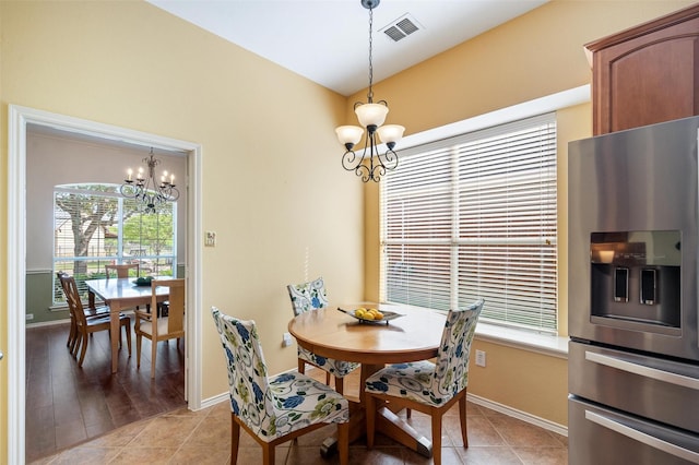 1060 Shepherd Ct, Lantana, TX 76226 - dining area featuring a chandelier, healthy amount of natural light, baseboards, and light tile patterned floors