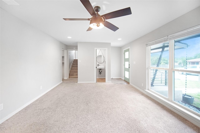 221 S 7th St, Jacksboro, TX 76458 - unfurnished room with a ceiling fan, light colored carpet, stairs, baseboards, and recessed lighting