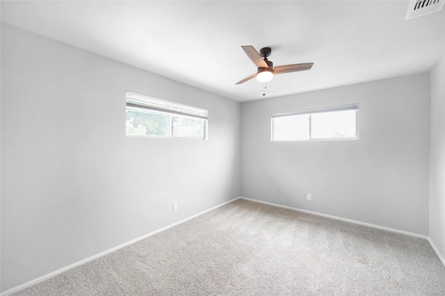 221 S 7th St, Jacksboro, TX 76458 - spare room with plenty of natural light, carpet flooring, a ceiling fan, and baseboards