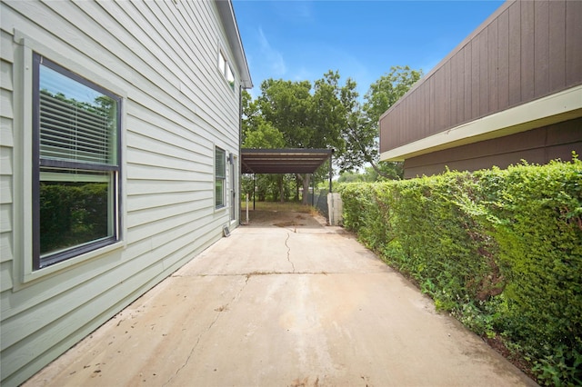 221 S 7th St, Jacksboro, TX 76458 - view of patio with a detached carport