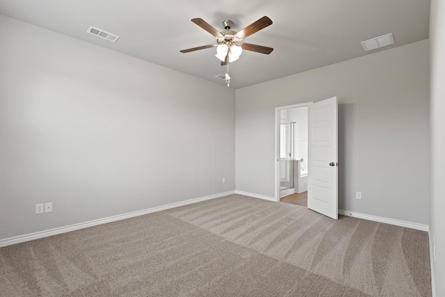 10605 Stag Ln, Fort Worth, TX 76036 - unfurnished bedroom with carpet, baseboards, connected bathroom, and ceiling fan
