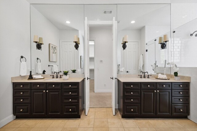 1120 Hemingway Ln, Irving, TX 75063 - full bath with two vanities, baseboards, a tile shower, tile patterned floors, and recessed lighting