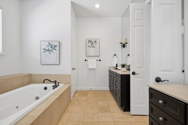 1120 Hemingway Ln, Irving, TX 75063 - full bathroom with vanity, a whirlpool tub, baseboards, and tile patterned floors