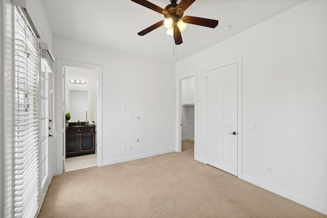 1120 Hemingway Ln, Irving, TX 75063 - unfurnished bedroom featuring light colored carpet, connected bathroom, baseboards, and a spacious closet