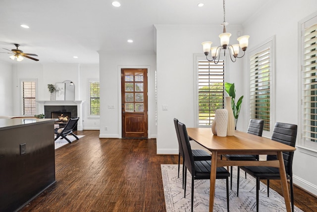 1120 Hemingway Ln, Irving, TX 75063 - dining space with a chandelier, dark wood-type flooring, healthy amount of natural light, recessed lighting, and baseboards
