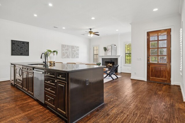 1120 Hemingway Ln, Irving, TX 75063 - kitchen with stainless steel dishwasher, a ceiling fan, a sink, dark wood-style floors, and recessed lighting