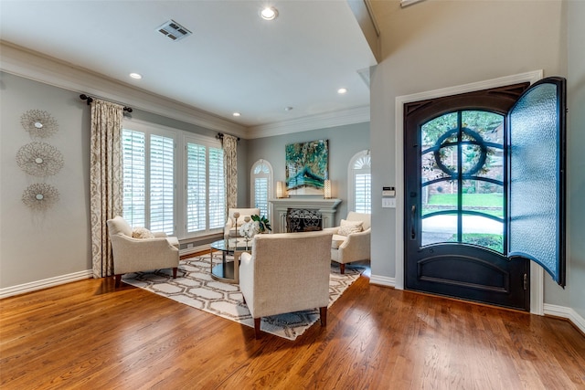 9352 Stratford Way, Dallas, TX 75220 - entryway with a fireplace, ornamental molding, baseboards, wood finished floors, and recessed lighting