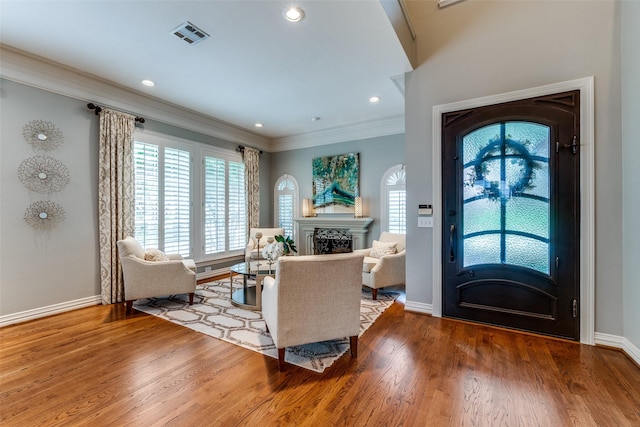 9352 Stratford Way, Dallas, TX 75220 - foyer featuring a fireplace, baseboards, ornamental molding, wood finished floors, and healthy amount of natural light