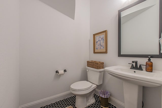 1050 Adair Rd, Prosper, TX 75078 - half bath with toilet, baseboards, a sink, and tile patterned floors