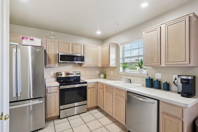 110 Apache Trl, Alvarado, TX 76009 - kitchen featuring appliances with stainless steel finishes, light brown cabinets, a sink, light tile patterned flooring, and recessed lighting