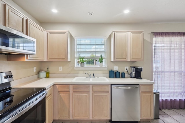 110 Apache Trl, Alvarado, TX 76009 - kitchen featuring stainless steel appliances, light brown cabinetry, a sink, light countertops, and light tile patterned flooring