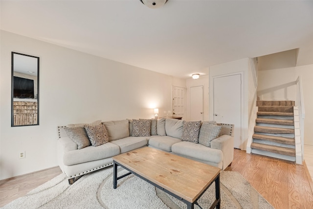 333 Melrose Dr Unit 26D, Richardson, TX 75080 - living room featuring stairway and light wood finished floors