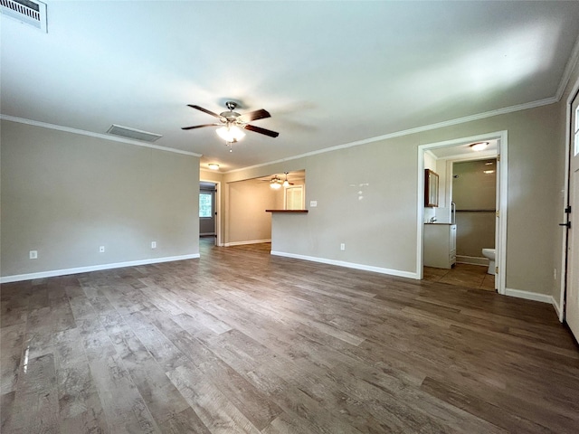 125 Park St E, Sulphur Springs, TX 75482 - unfurnished living room featuring a ceiling fan, wood finished floors, baseboards, and ornamental molding