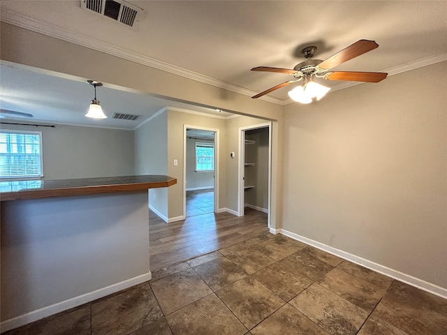 125 Park St E, Sulphur Springs, TX 75482 - unfurnished room with healthy amount of natural light, ornamental molding, ceiling fan, and baseboards