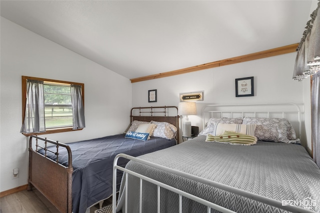 367 Penobscot Trl, Henrietta, TX 76365 - bedroom featuring lofted ceiling, wood finished floors, and baseboards