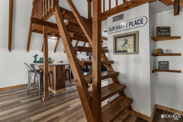 367 Penobscot Trl, Henrietta, TX 76365 - stairs with wood finished floors, baseboards, and beamed ceiling