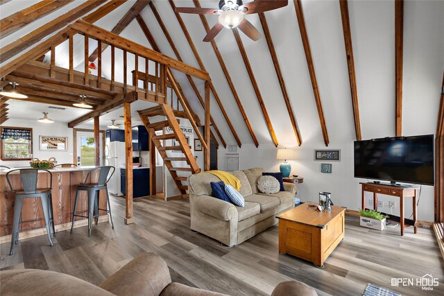 367 Penobscot Trl, Henrietta, TX 76365 - living area with ceiling fan, stairs, light wood finished floors, beam ceiling, and high vaulted ceiling