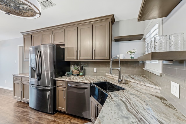 6607 Canalview Dr, Arlington, TX 76016 - kitchen with open shelves, stainless steel appliances, a sink, and decorative backsplash