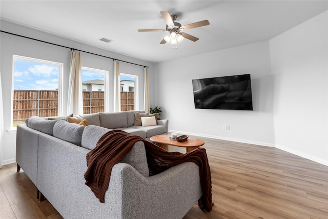 2939 Peony Dr, Sherman, TX 75092 - living room with wood finished floors, baseboards, and a ceiling fan