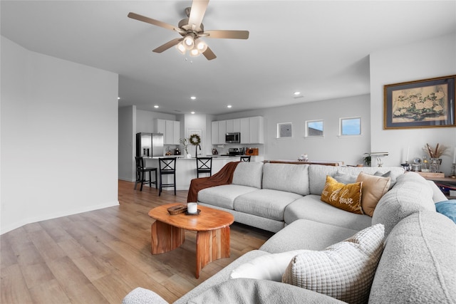 2939 Peony Dr, Sherman, TX 75092 - living area featuring recessed lighting, light wood finished floors, ceiling fan, and baseboards