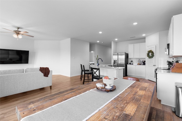 2939 Peony Dr, Sherman, TX 75092 - dining area featuring wood-type flooring, recessed lighting, ceiling fan, and baseboards
