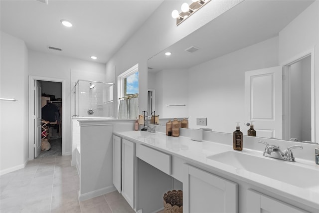 2939 Peony Dr, Sherman, TX 75092 - full bath featuring a shower stall, double vanity, a spacious closet, recessed lighting, and tile patterned floors