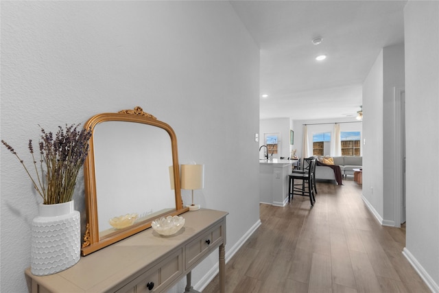 2939 Peony Dr, Sherman, TX 75092 - hallway featuring wood finished floors, baseboards, and recessed lighting